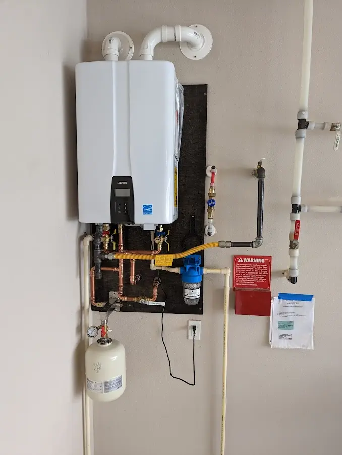 Professional plumber installing copper piping in a Harvey home