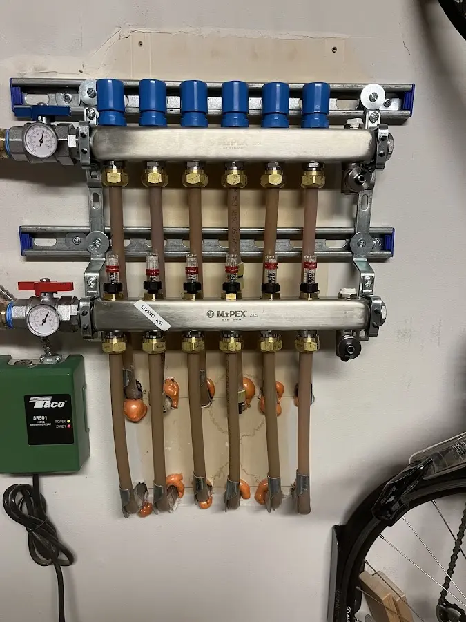 Plumber performing Water Heater Repair at a residential property in Harvey